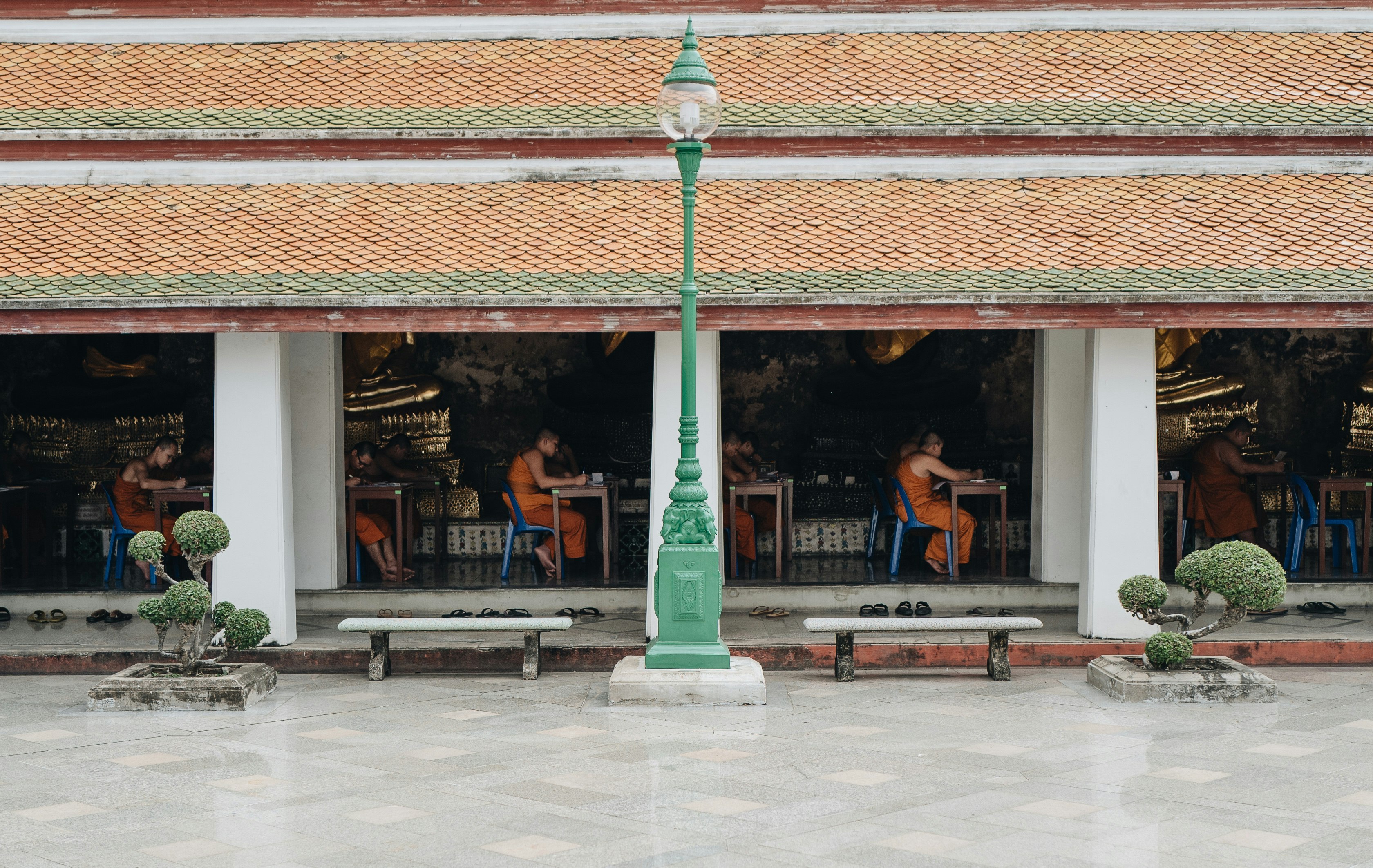 people sitting on chairs inside building